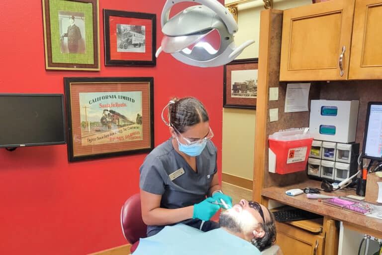 Dental Depot's Broken Arrow dental hygienist cleans the teeth of a patient.