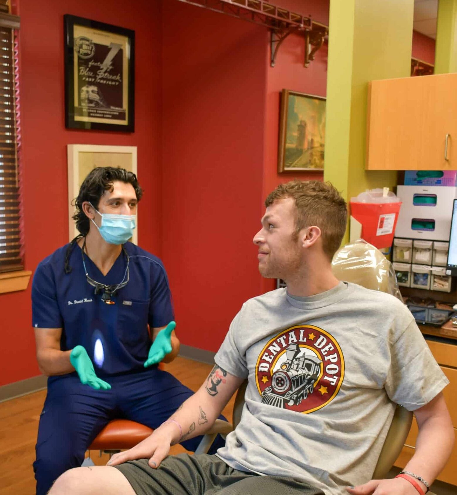 Dr. Keesh, Dentist in Tulsa talks to a patient about his dental health.