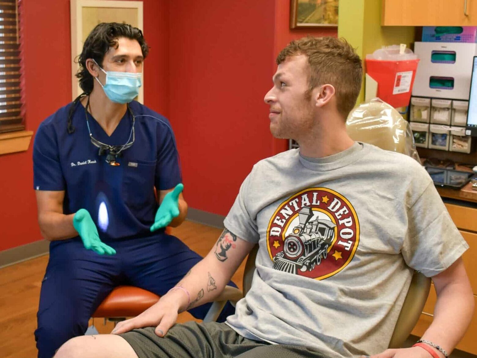 Dr. Keesh, Dentist in Tulsa talks to a patient about his dental health.