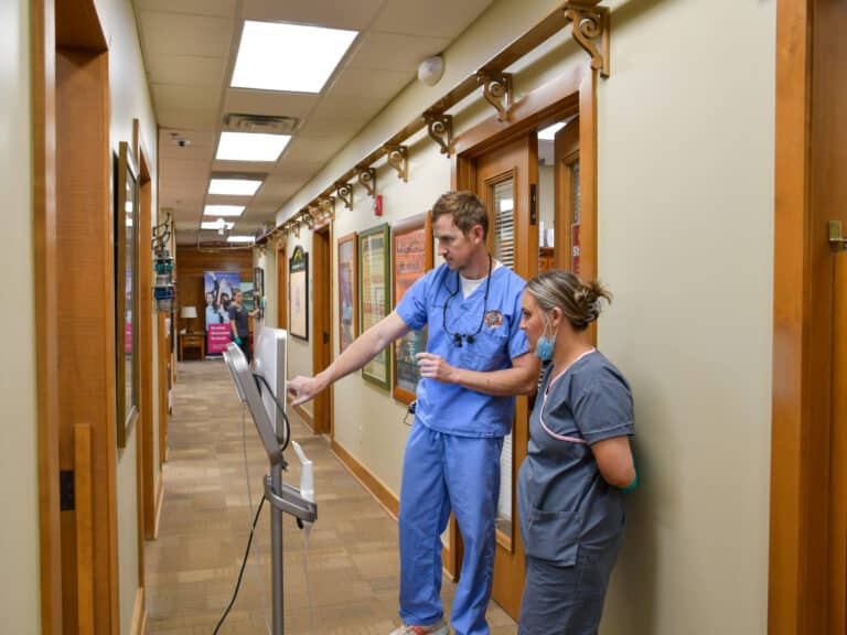 The dental team discussing a patient's exam results.