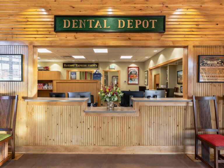 Tulsa Hills dental clinic waiting room and reception area with train themed signage and natural wood panels