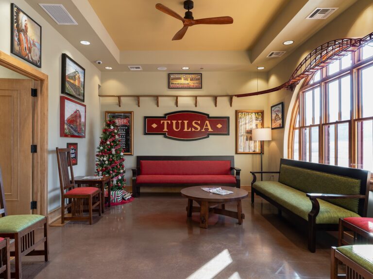 Tulsa Hills dental clinic waiting room and reception area with train themed signage and red furniture