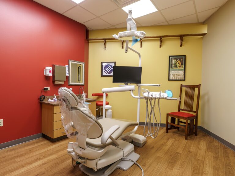 Dental operatory at Dental Depot's NW 63rd St Oklahoma City Dental office with dental chair and train themed pictures.