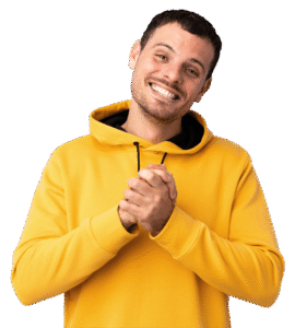 Young man smiles with straight teeth from Invisalign