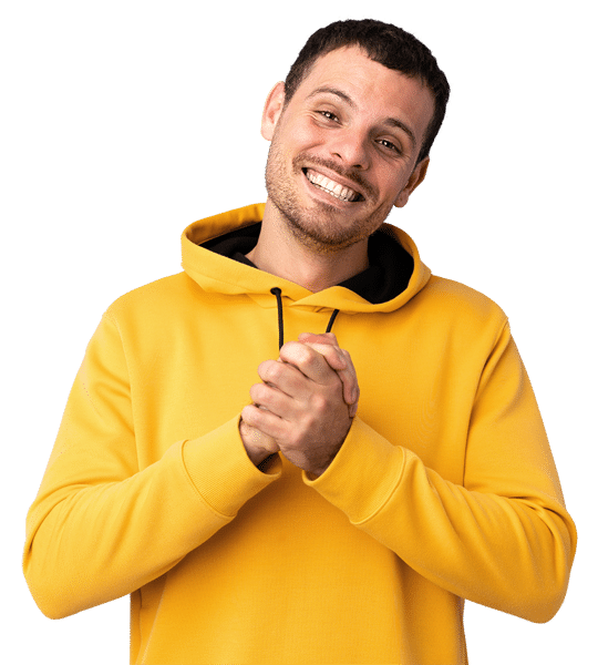 Young man in a yellow hoodie smiles