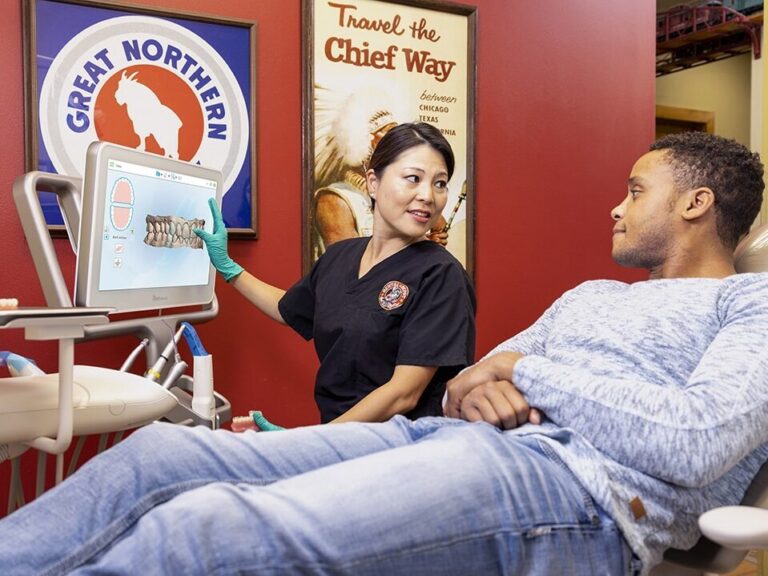 A young man gets consulted on his dental care at dental depot