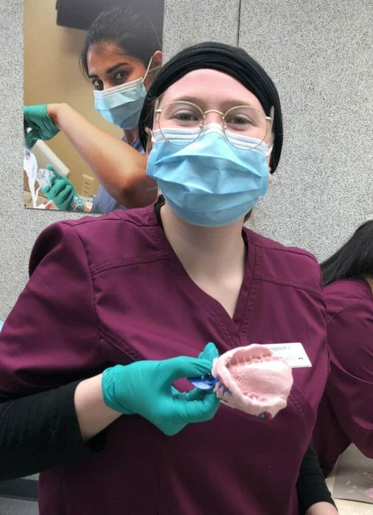 Augusta Emmerson showing off her first dental impression