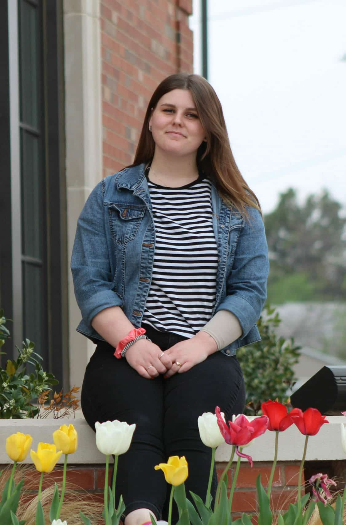 Dental Depots March EOM Cheyenne McArthur Sits Among Tulips