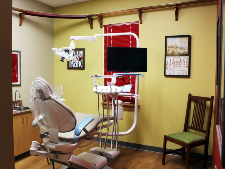 West Norman Dental clinic interior office with dental chair and equipment